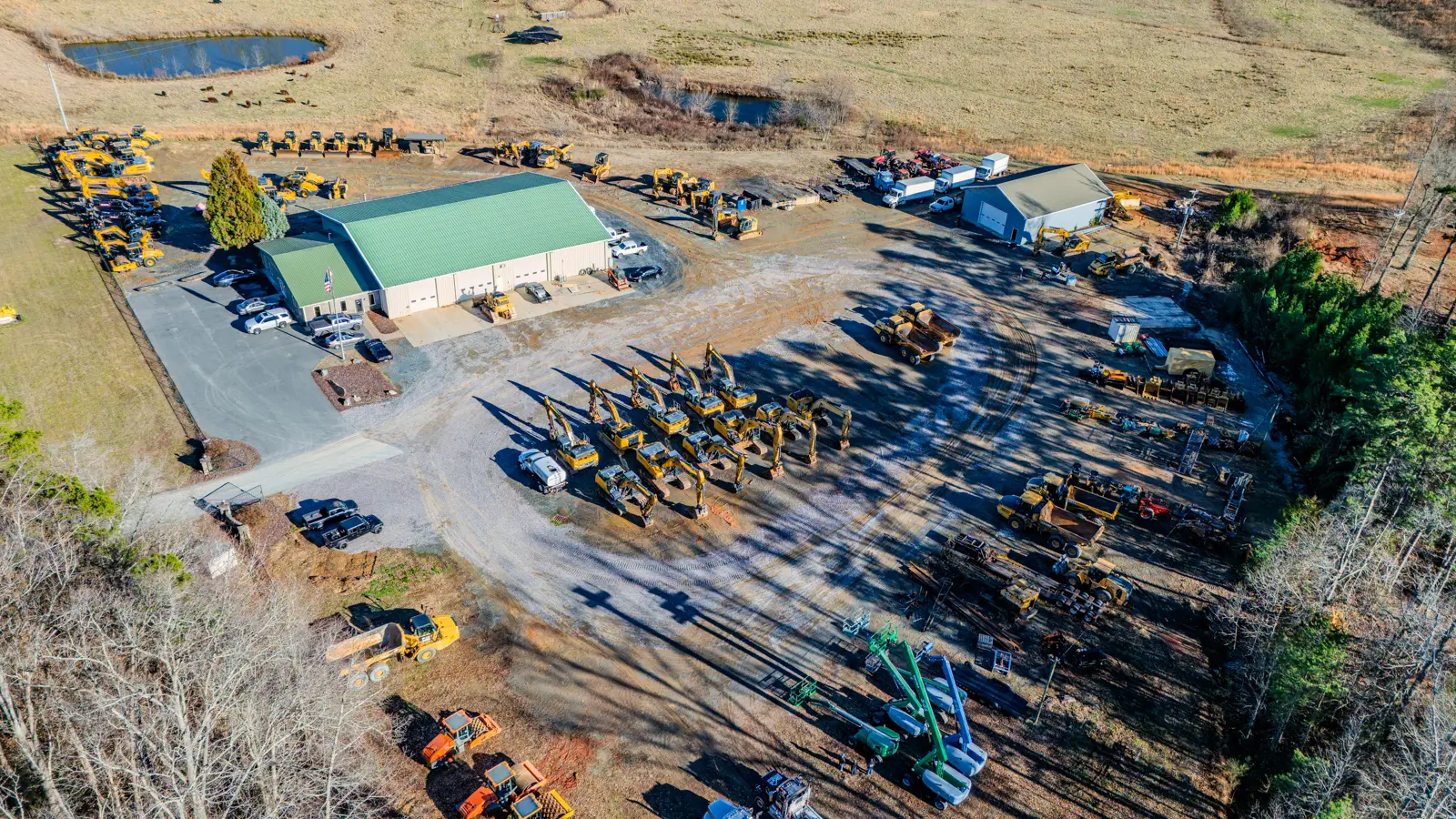 Drone shot of Skye Equipment lot with heavy equipment for sale